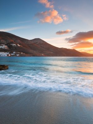 View of Aegiali village from a nearby beach, Amorgos island, Greece.